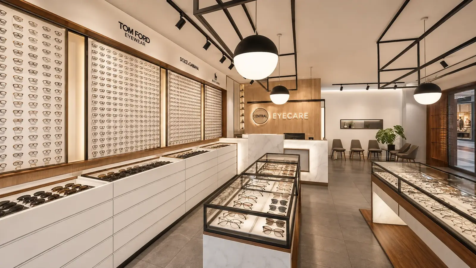 Central Eyecare in Punchbowl: walls of lit eyewear displays, glass cabinets and black pendant lights, with the reception behind